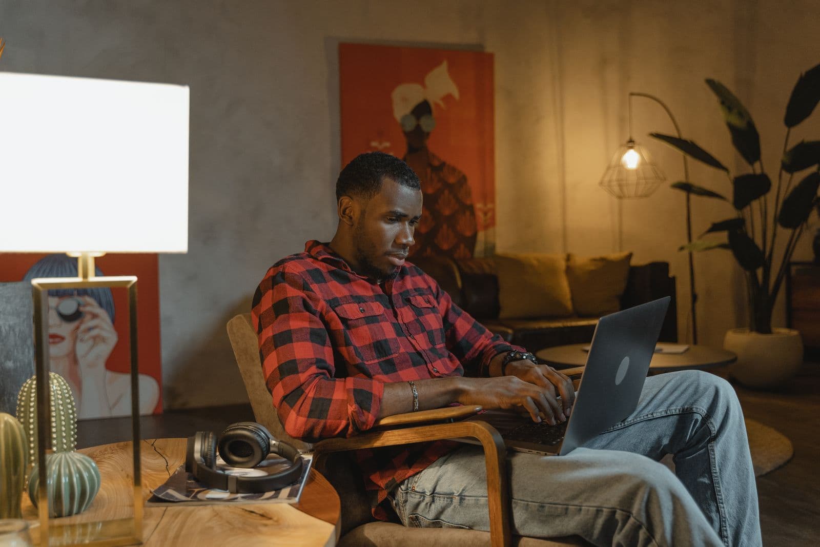 A freelancer working on a laptop from a home office