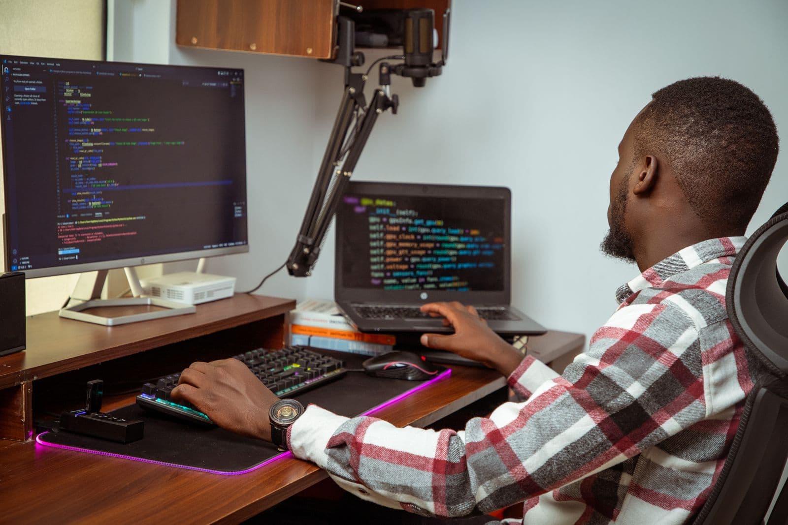 A salaried employee working at his desk in a Nairobi office, the kind of worker whose monthly pay has PAYE, NSSF, SHIF and housing levy deducted.