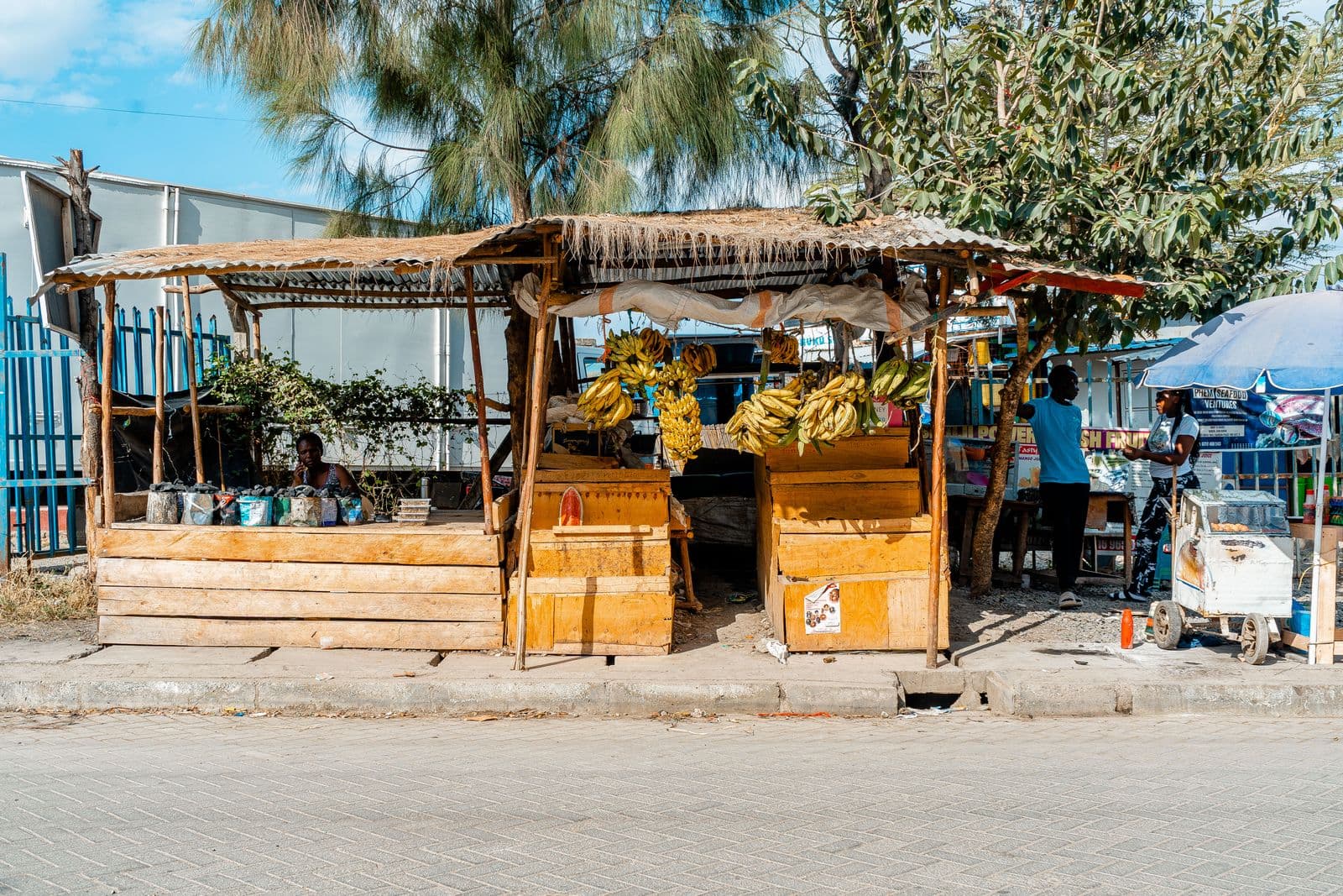 A small trader selling produce at a street market in Nairobi, the kind of business that uses Pochi la Biashara to take phone payments