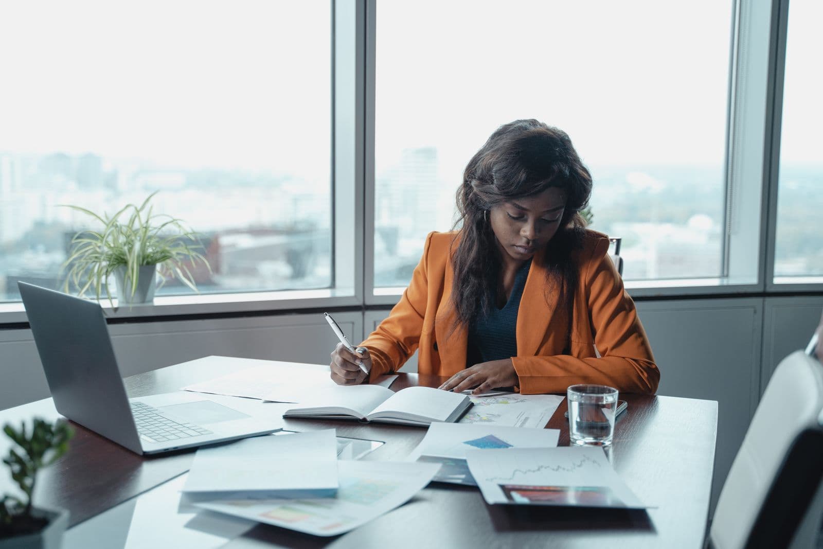 A South African taxpayer reviewing her SARS tax documents at her desk ahead of the filing deadline