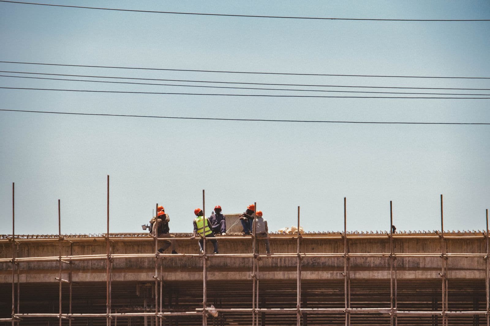Construction workers on scaffolding at a building site in Nairobi, Kenya