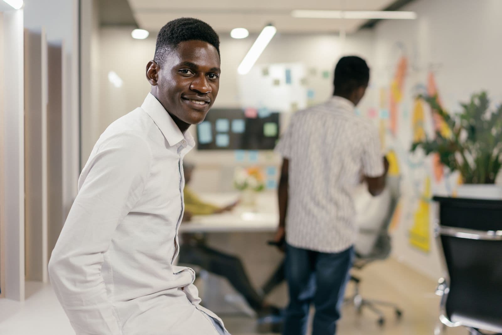Smiling man at work in a modern office