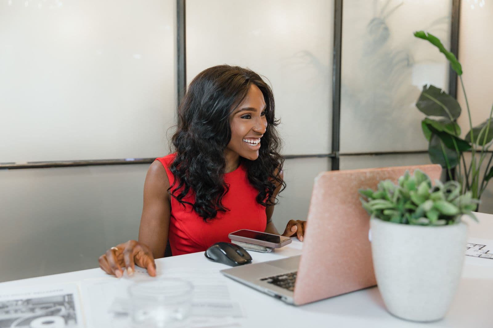 South African small business owner registering her company online at her desk